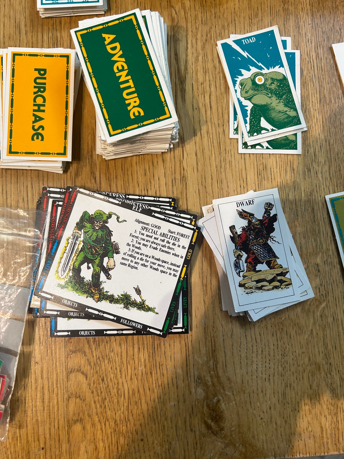 Talisman second edition (near complete but missing rules and two out of 40 blue tokens) come with 14 extra character cards and info sheets, 36 extra adventure cards and 6 extra spell cards all shown in the last few photos