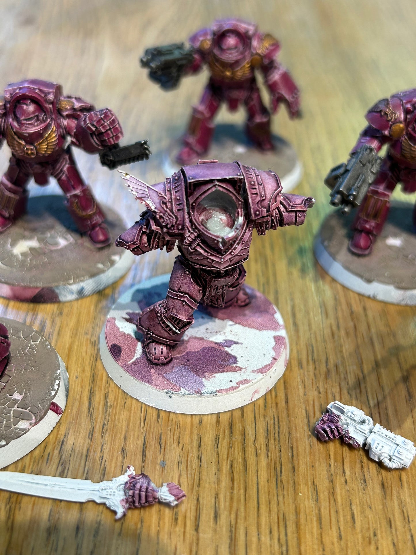Emperor’s children Horus Heresy terminators (I believe they’re the earlier forge world ones). Missing one head and the banner pole