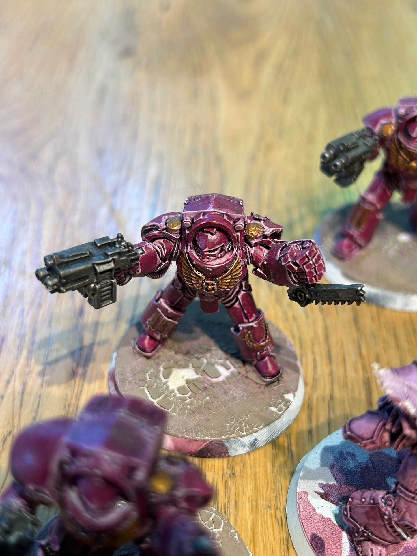 Emperor’s children Horus Heresy terminators (I believe they’re the earlier forge world ones). Missing one head and the banner pole
