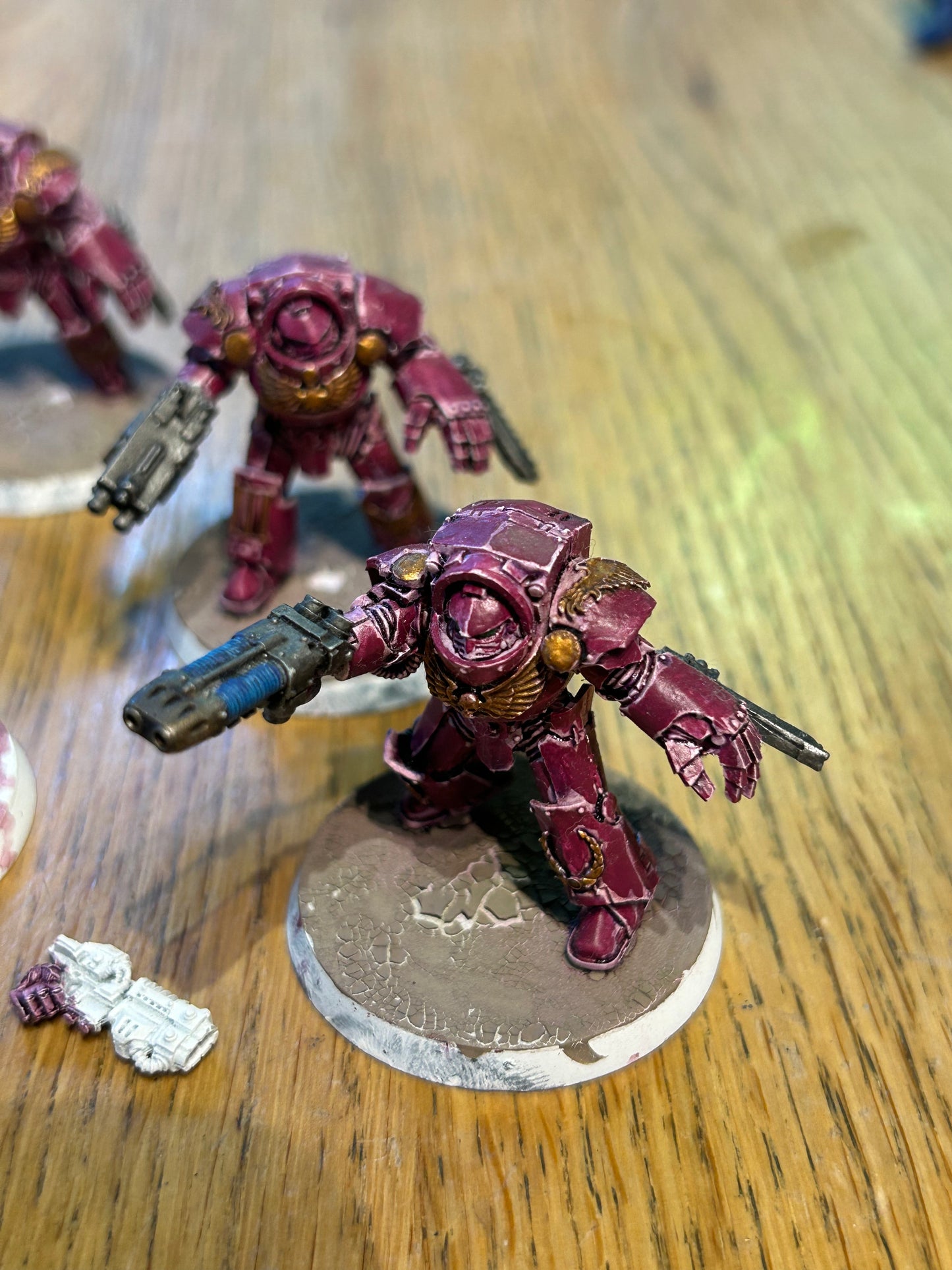 Emperor’s children Horus Heresy terminators (I believe they’re the earlier forge world ones). Missing one head and the banner pole