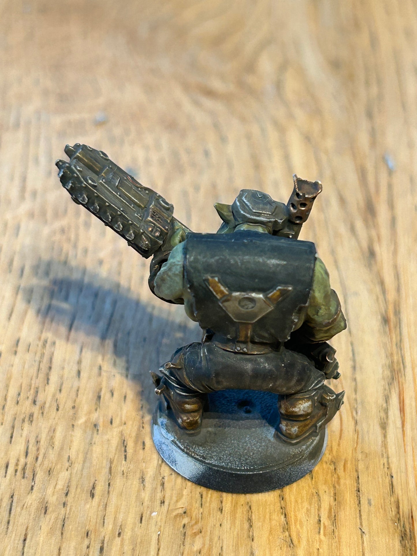 Warhammer 40k ork with two buzz-axe (not sure what the name of the weapon is)