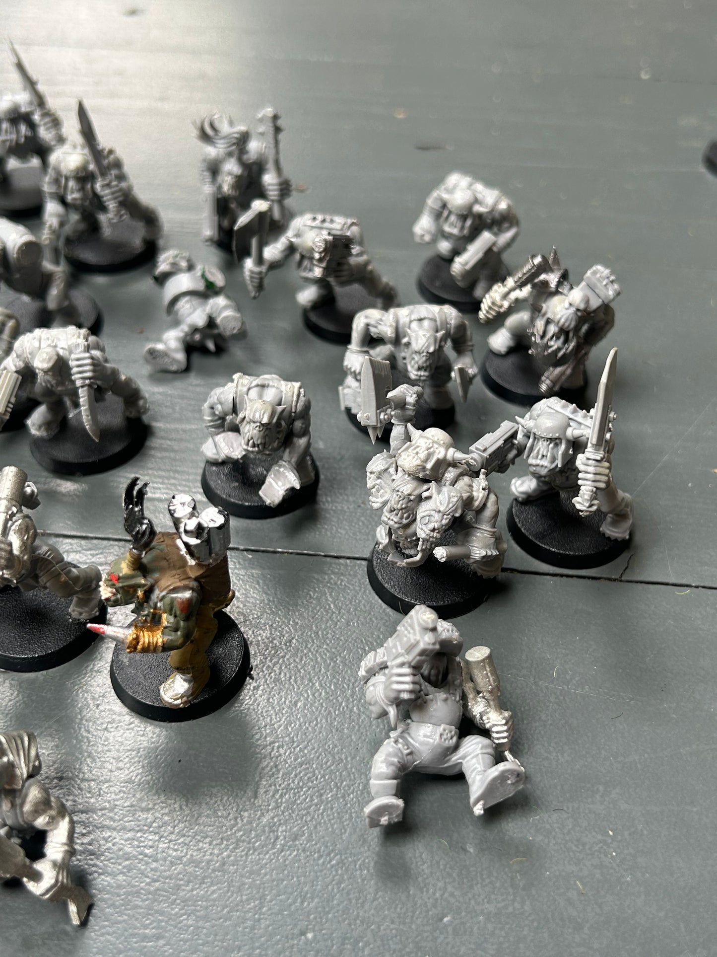 Warhammer 40k plastic ork boys x22 (various states of wear but includes some parts to fix some of them up. Also includes stikk bomb metal parts)