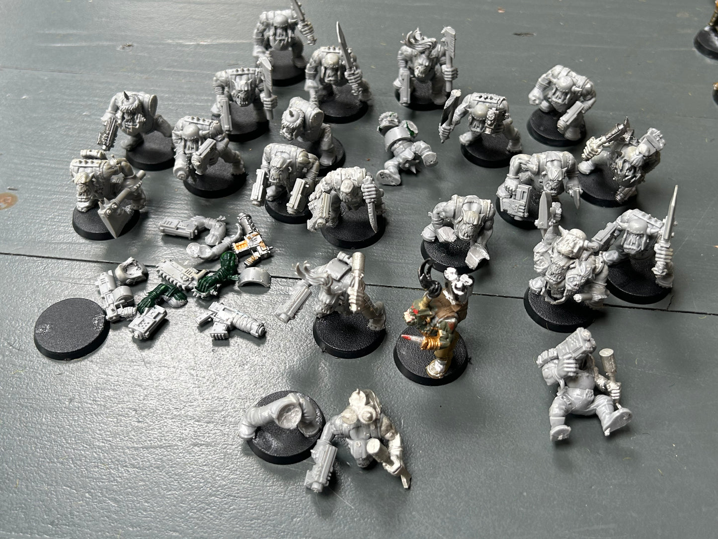 Warhammer 40k plastic ork boys x22 (various states of wear but includes some parts to fix some of them up. Also includes stikk bomb metal parts)