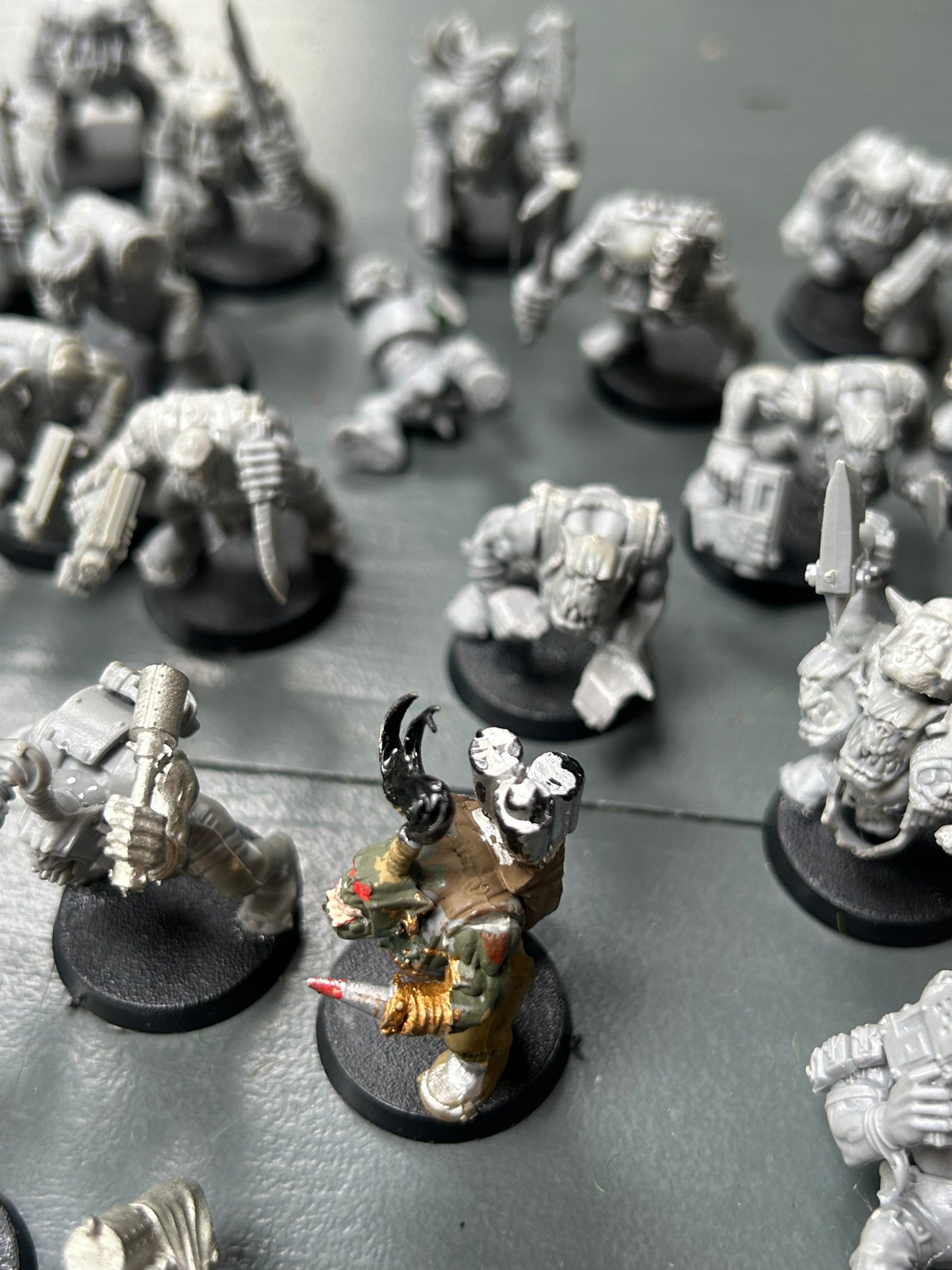 Warhammer 40k plastic ork boys x22 (various states of wear but includes some parts to fix some of them up. Also includes stikk bomb metal parts)