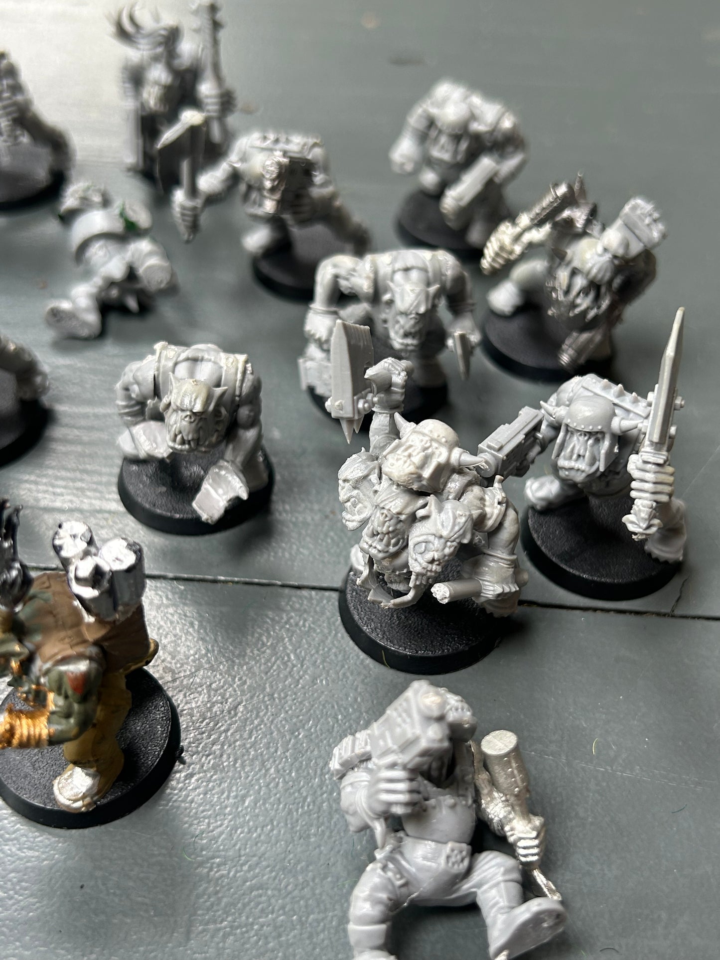 Warhammer 40k plastic ork boys x22 (various states of wear but includes some parts to fix some of them up. Also includes stikk bomb metal parts)
