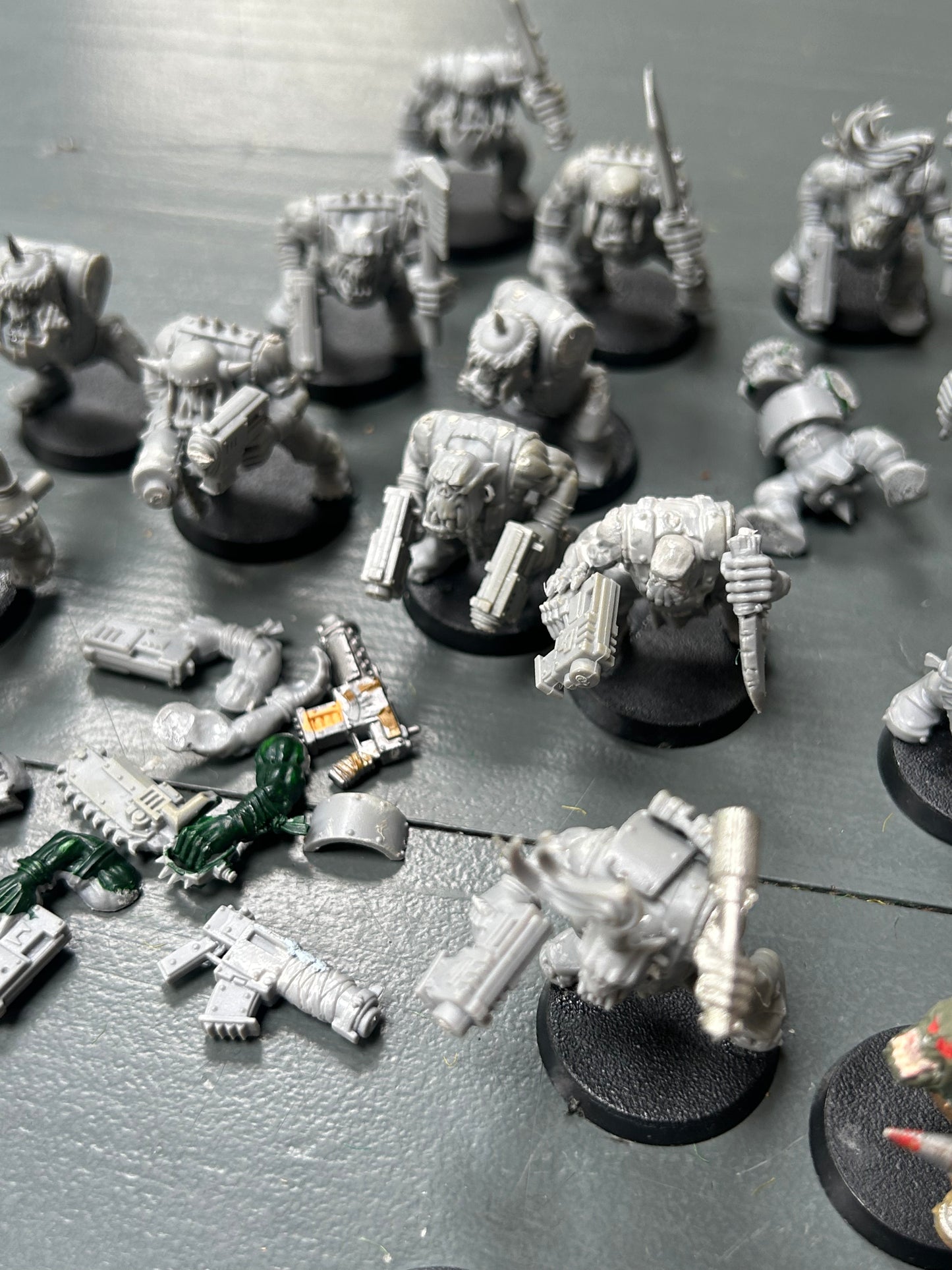 Warhammer 40k plastic ork boys x22 (various states of wear but includes some parts to fix some of them up. Also includes stikk bomb metal parts)