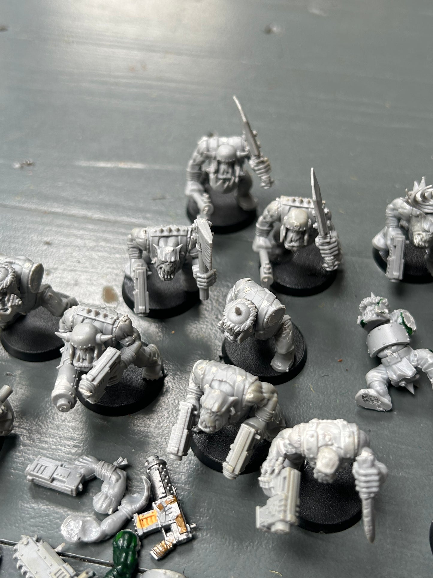 Warhammer 40k plastic ork boys x22 (various states of wear but includes some parts to fix some of them up. Also includes stikk bomb metal parts)
