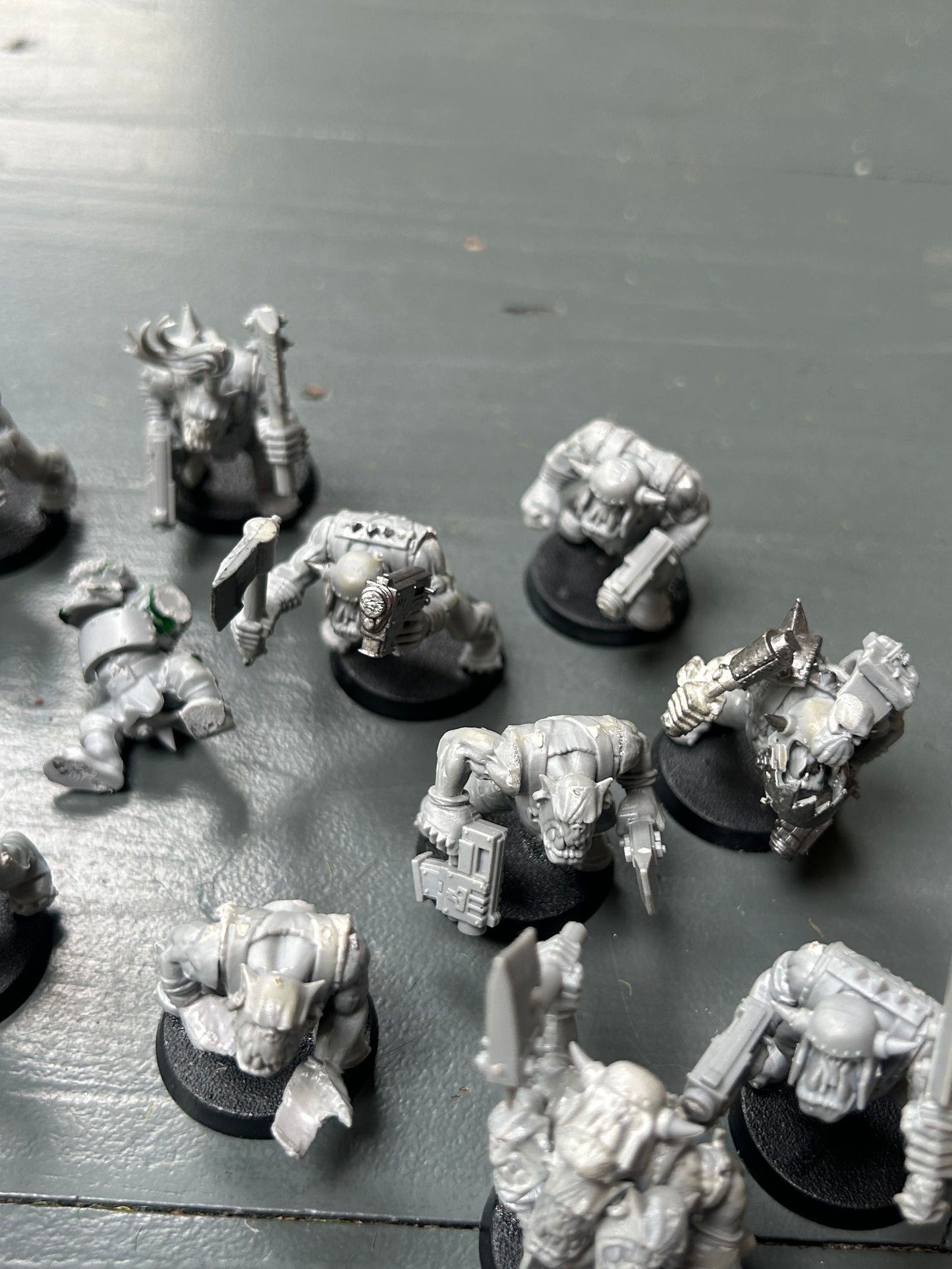 Warhammer 40k plastic ork boys x22 (various states of wear but includes some parts to fix some of them up. Also includes stikk bomb metal parts)