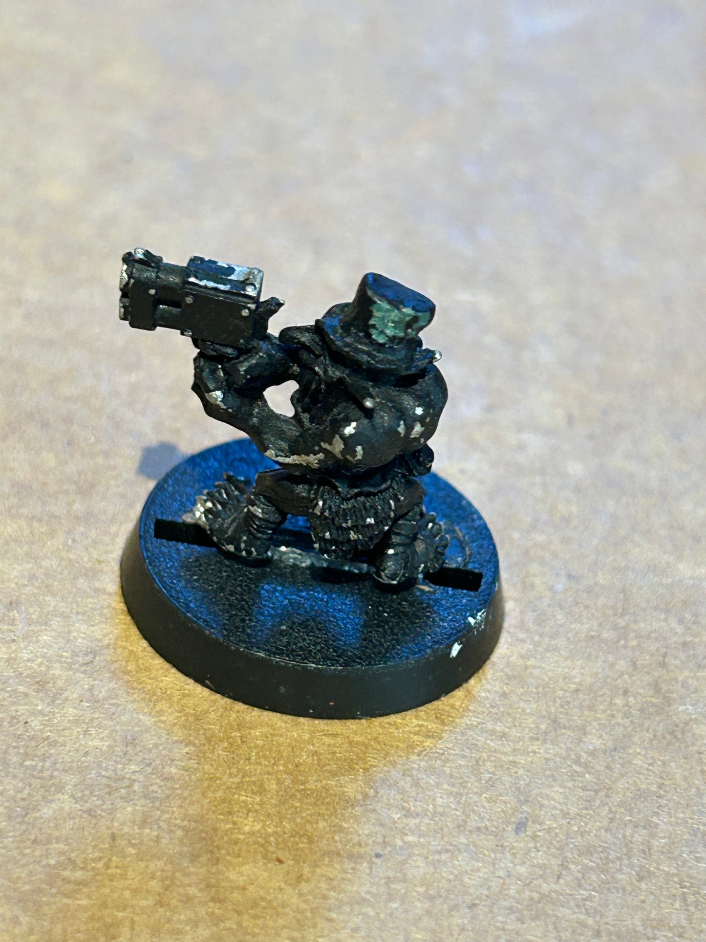 Warhammer 40k metal grot (has had a green stuff top hat glued on)