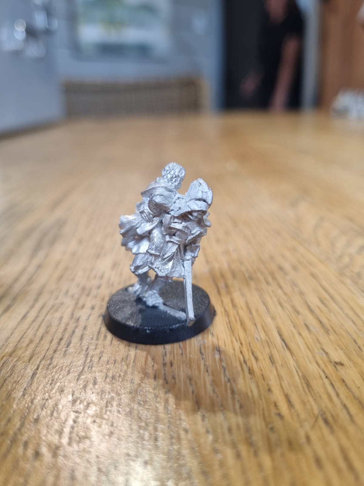 Middle earth strategy battle game Lord of the rings uruk hai with hobbit (merry or pippin, not sure which)
