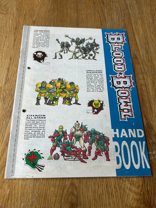 Bloodbowl second edition handbook (has some paint that’s bled through the back)