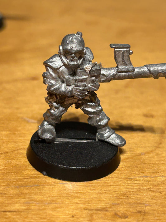 Rogue Trader Imperial Guard Grenadier grenade launcher (has some paint flakes stuck to him)