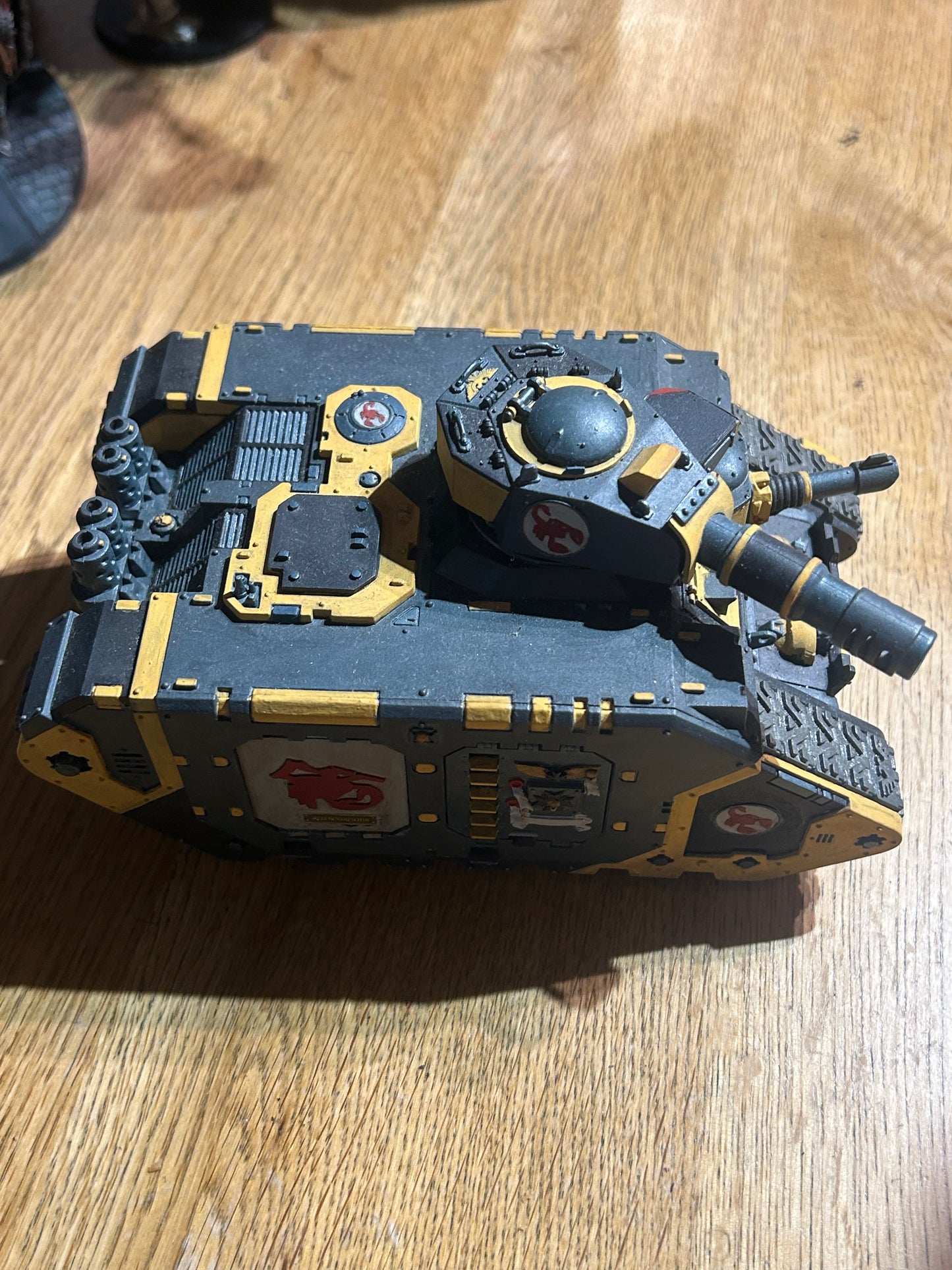Warhammer 40k space marines or imperial guard converted leman Russ or land raider (not sure) done up to be red scorpions chapter