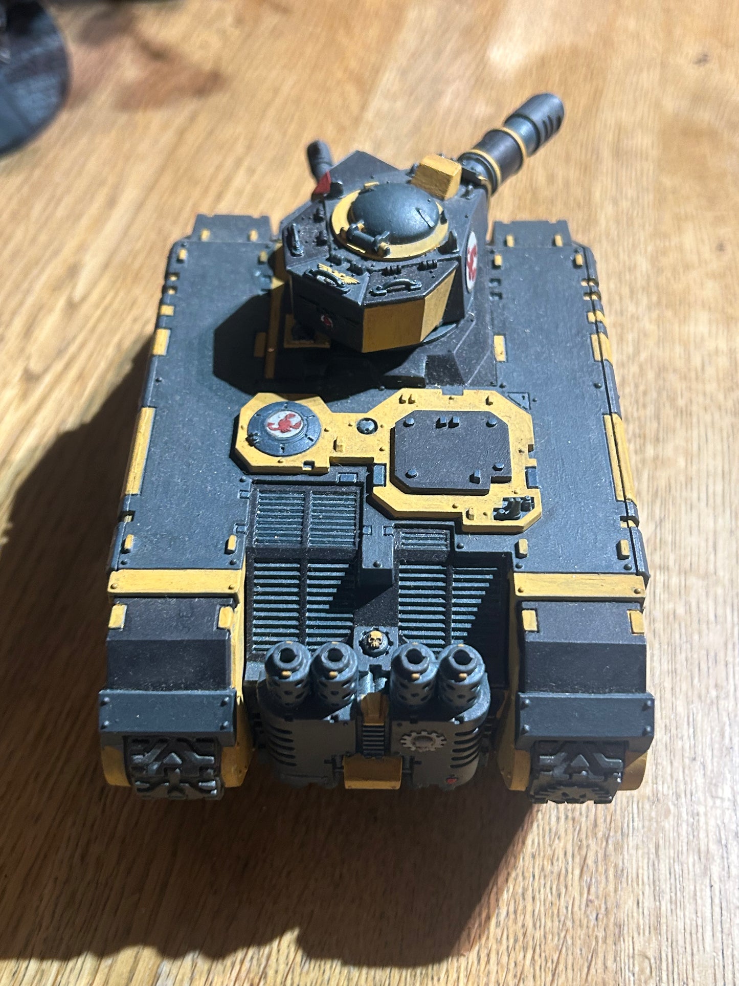 Warhammer 40k space marines or imperial guard converted leman Russ or land raider (not sure) done up to be red scorpions chapter
