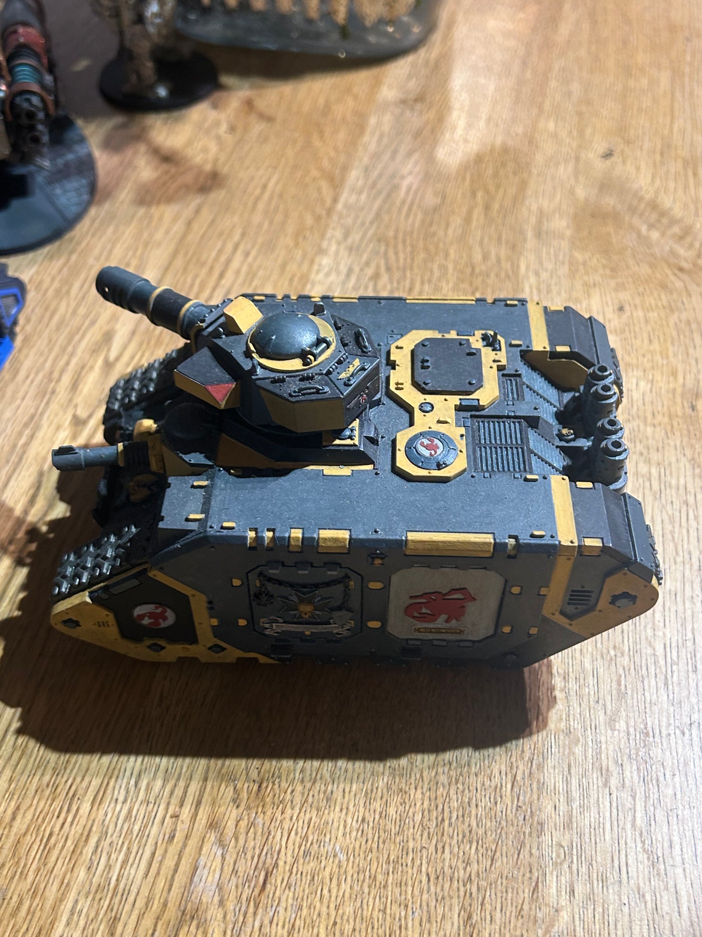 Warhammer 40k space marines or imperial guard converted leman Russ or land raider (not sure) done up to be red scorpions chapter