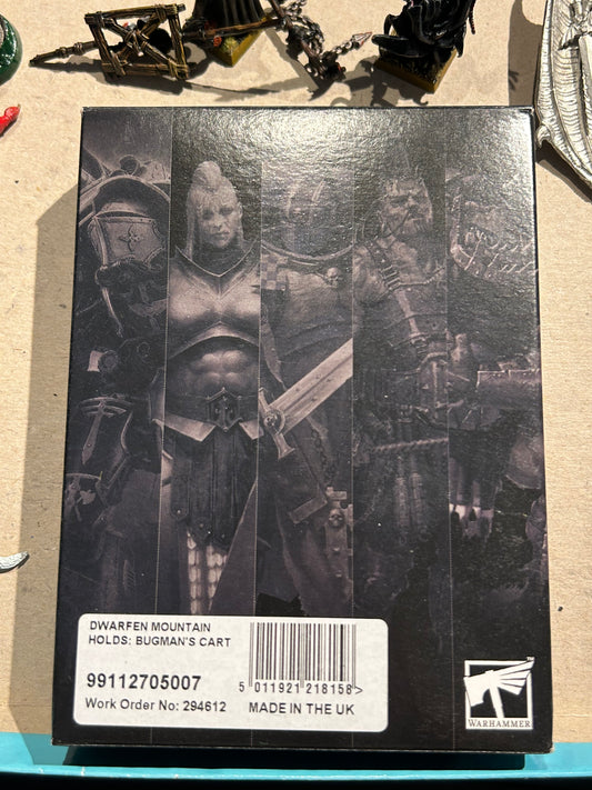 Dwarfed mountain holds Bugman’s cart boxed