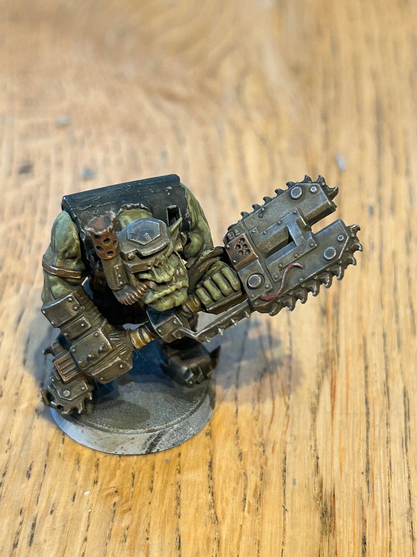 Warhammer 40k ork with two buzz-axe (not sure what the name of the weapon is)