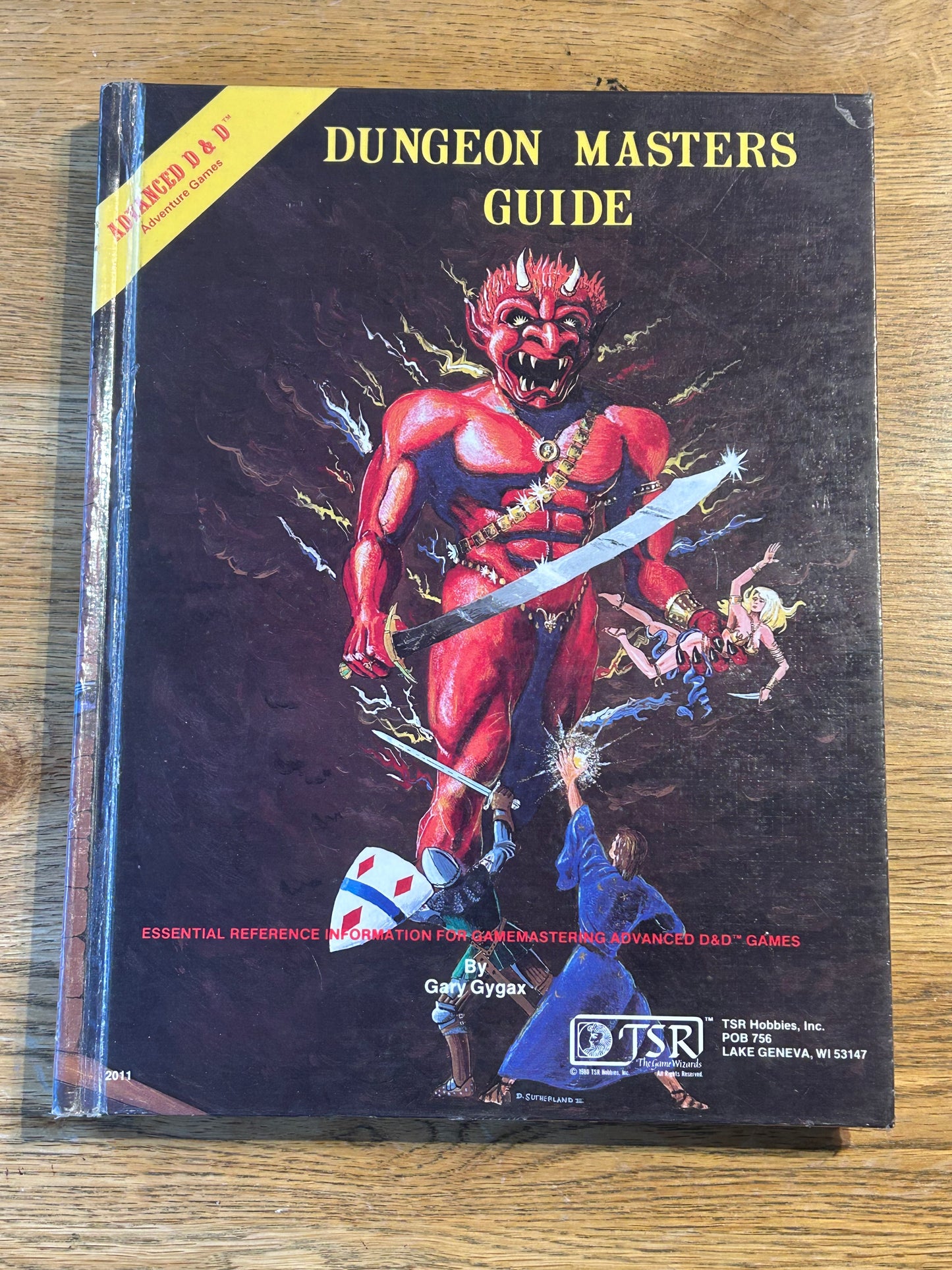 Advanced Dungeons & Dragons Dungeon Masters Guide  - 1979 TSR (has been coated in a layer of plastic wrap to protect the book and has the previous owner’s name in it as well as a very lovely dedication from his fellow players)