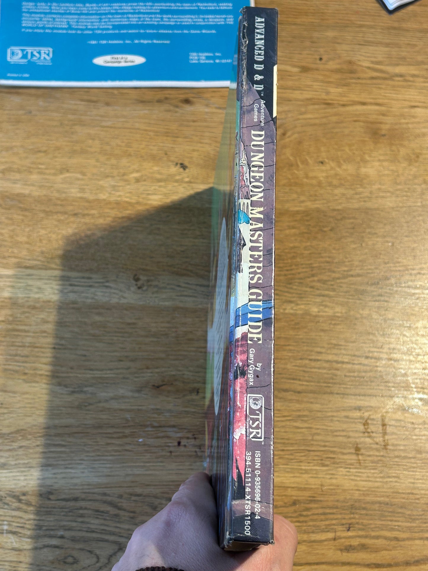 Advanced Dungeons & Dragons Dungeon Masters Guide  - 1979 TSR (has been coated in a layer of plastic wrap to protect the book and has the previous owner’s name in it as well as a very lovely dedication from his fellow players)