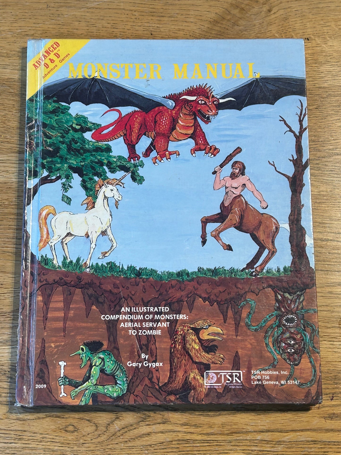 MONSTER MANUAL - Advanced Dungeons &  Dragons - HARDBACK (has been coated in a layer of plastic wrap to protect the book and has the previous owner’s name in it)