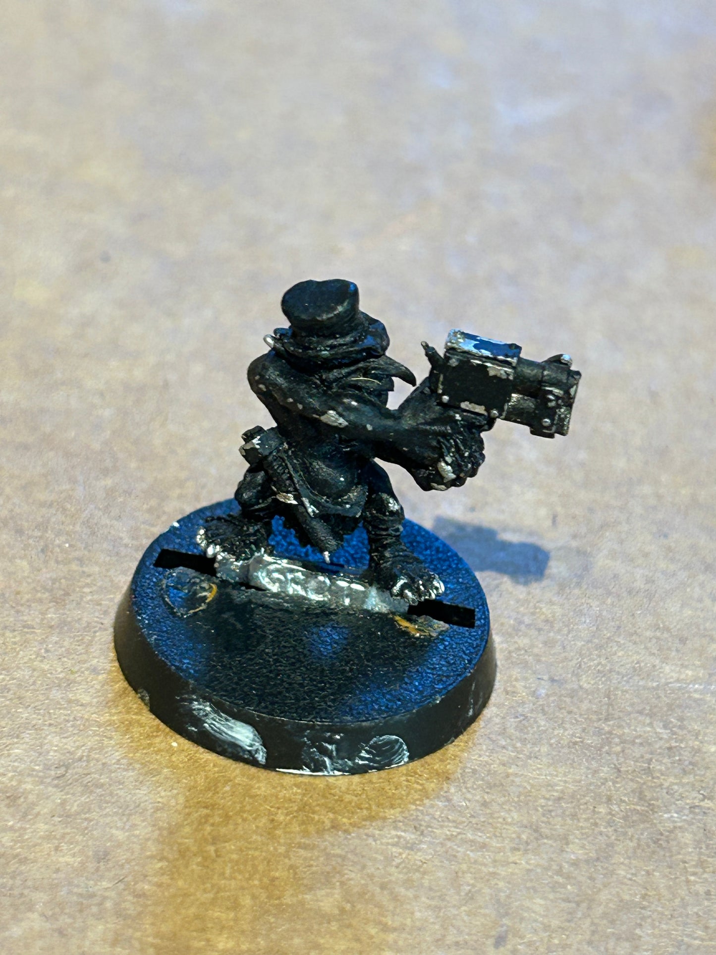 Warhammer 40k metal grot (has had a green stuff top hat glued on)