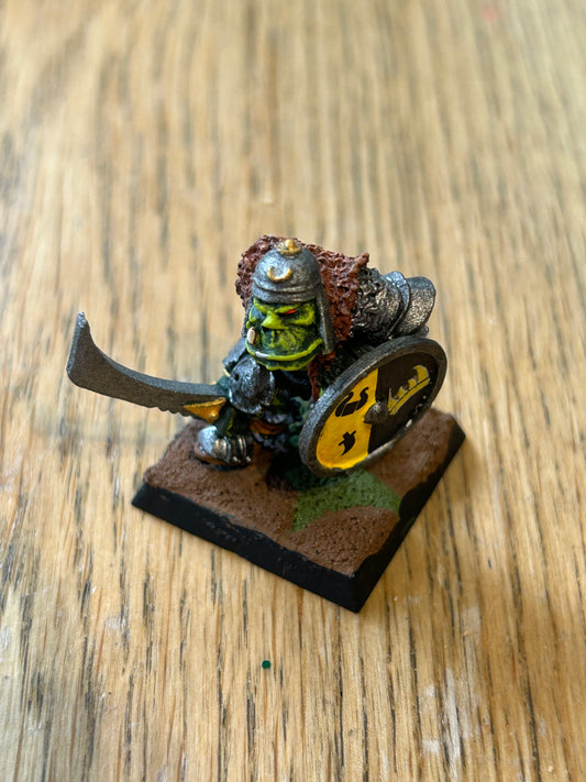 Warhammer fantasy orc leader with sword and shield