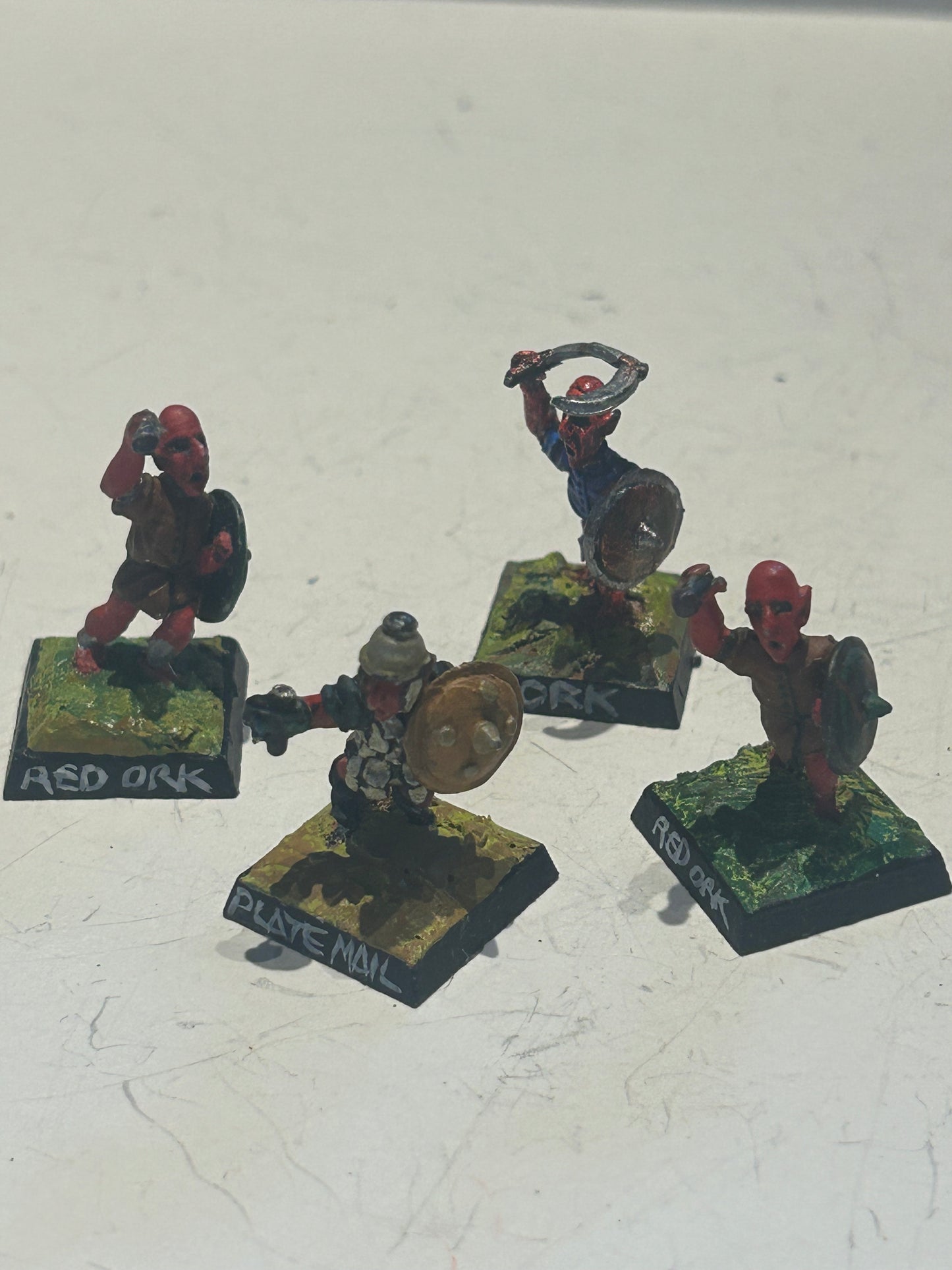 Citadel fiend factory red orcs x4 (three missing weapons and one with a bent weapon)