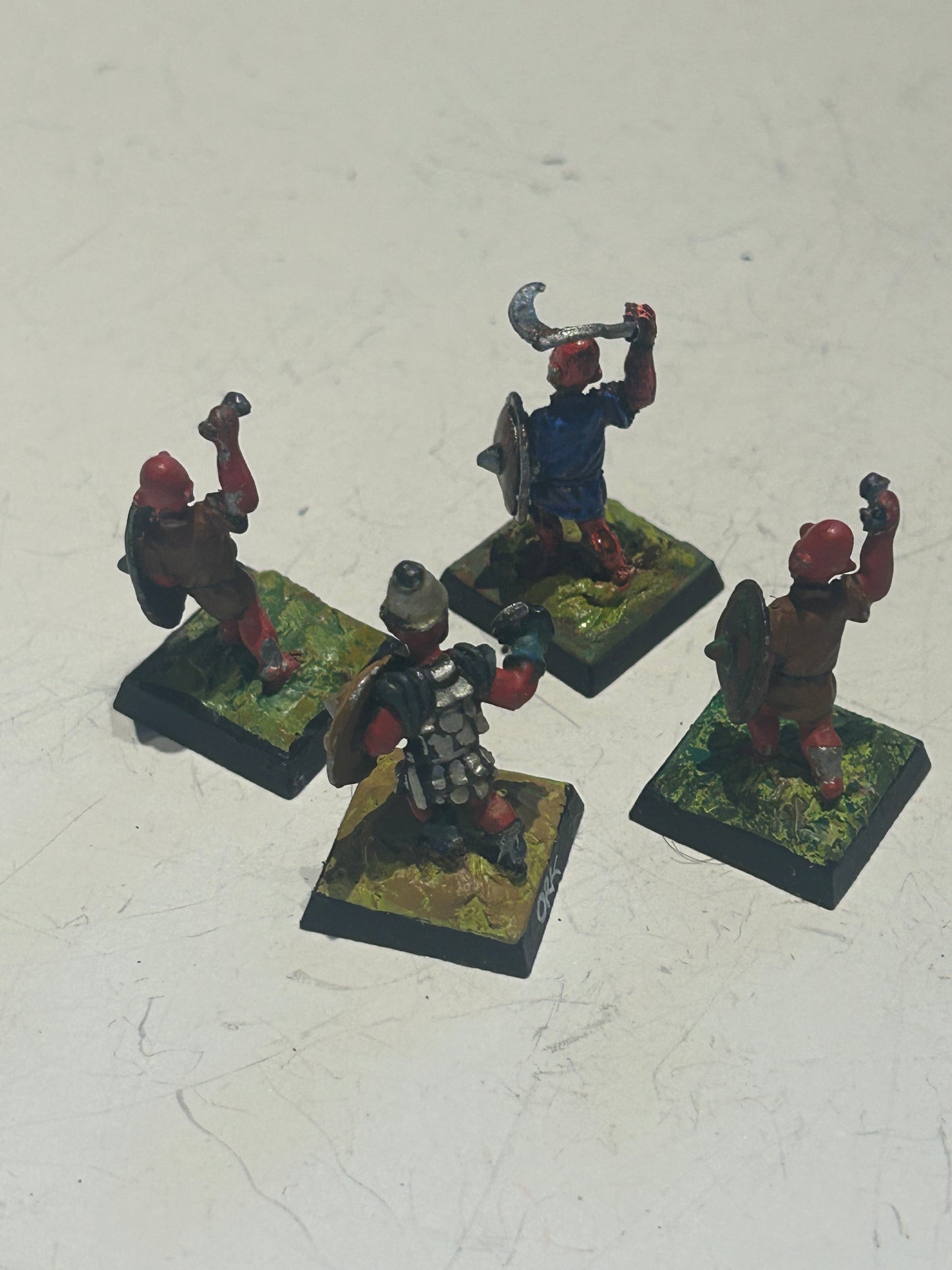 Citadel fiend factory red orcs x4 (three missing weapons and one with a bent weapon)