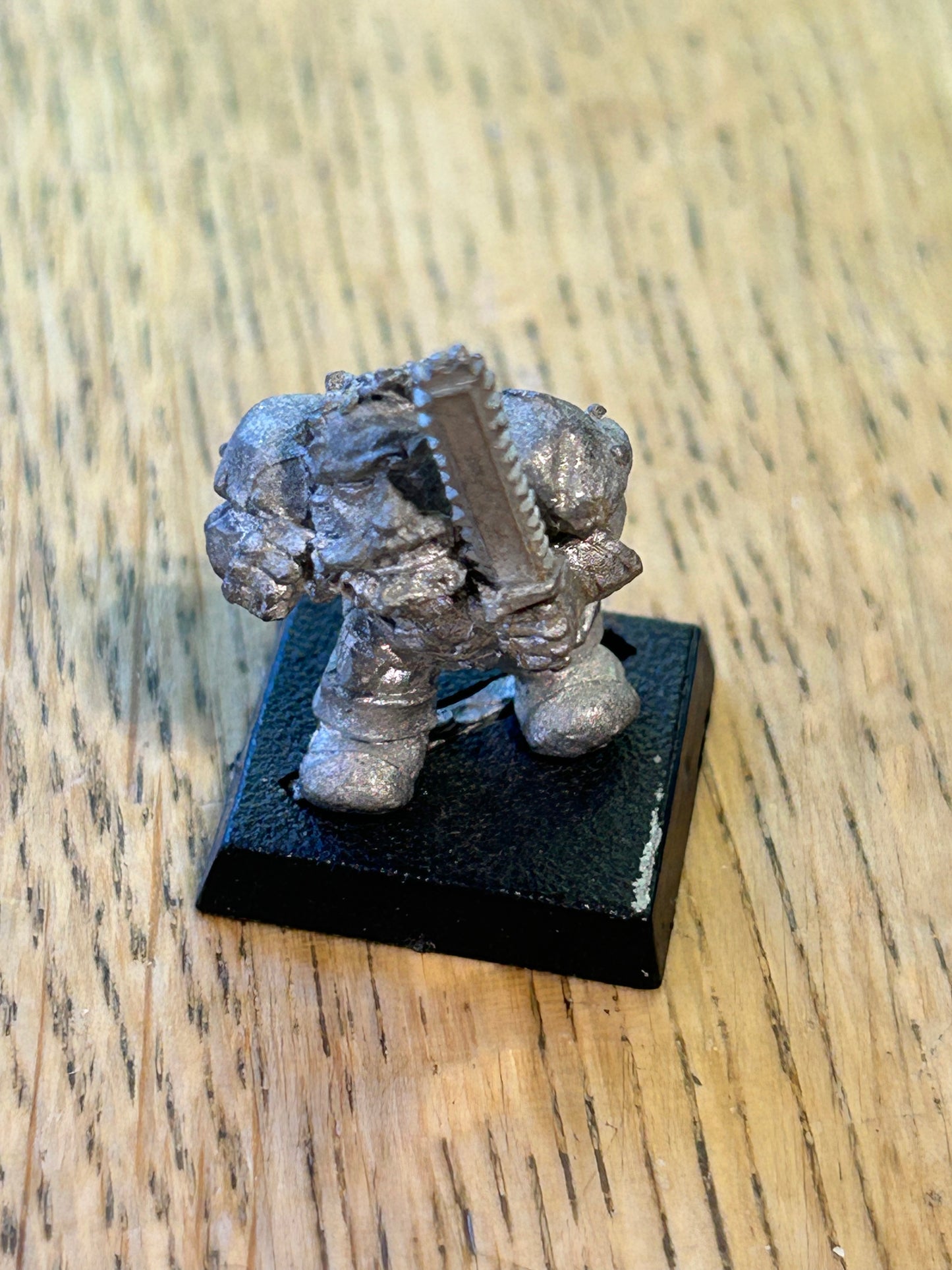 Bloodbowl dwarf blitzer converted to hold a chainsaw