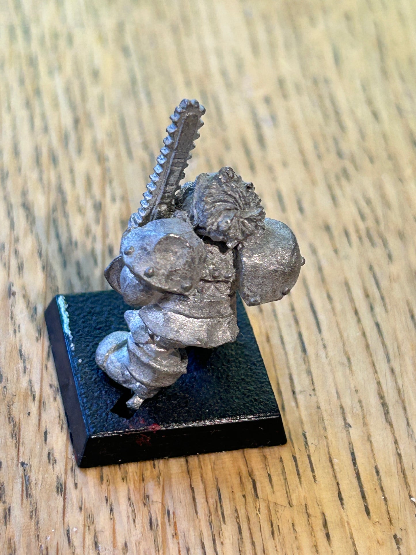 Bloodbowl dwarf blitzer converted to hold a chainsaw