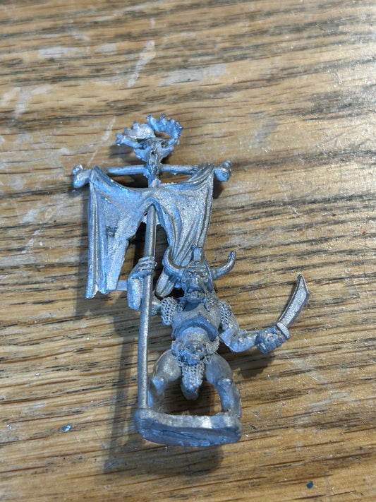 Chaos orc standard bearer 
 ral partha